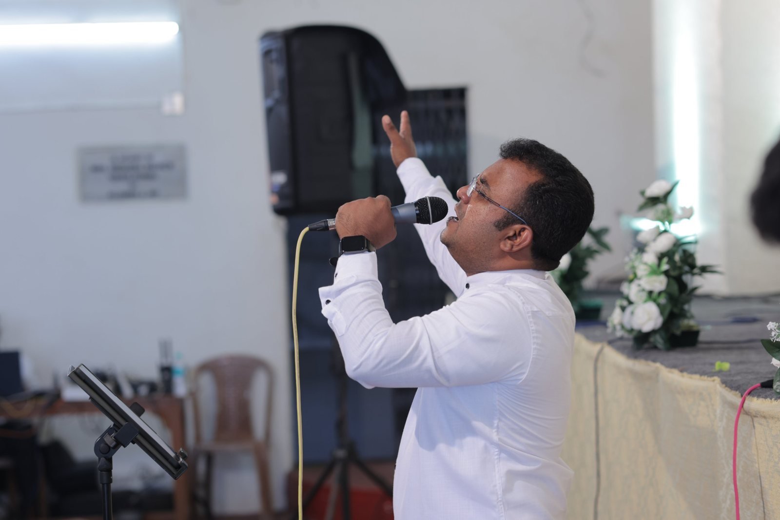 Stanley Abraham singing praise at a church service